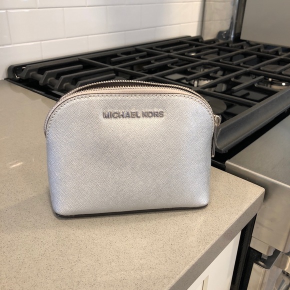 Michael Kors Handbags - 👜Michael Kors silver make up bag authentic